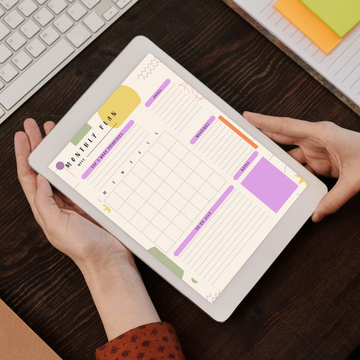 Person looking at monthly work planner