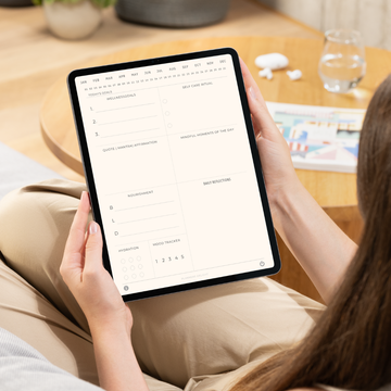 Woman using digital daily planner on iPad — Paperless Essentials
