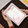 Hands holding iPad with digital daily planner PDF showing hourly schedule to-do list meal tracker and water intake tracker.
