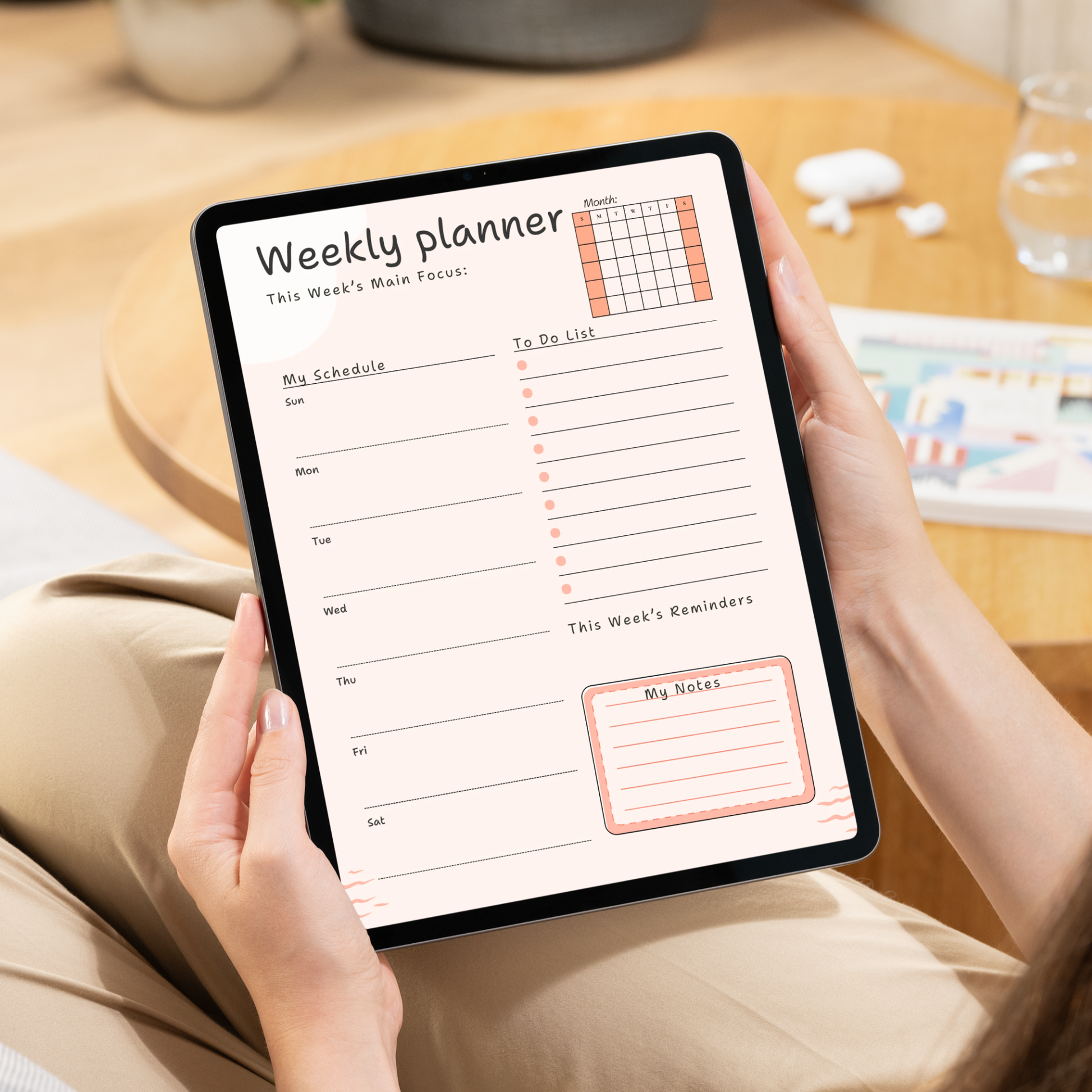 Undated digital hourly daily and weekly planner PDF bundle shown side by side on two iPads with a clean minimal design in warm peach and blush tones, the daily planner featuring a month mini calendar, today's main focus field, hourly schedule from 06:00 to 20:00, to do list with checkboxes, water intake tracker with eight glasses, and a notes section, and the weekly planner featuring a month mini calendar, this week's main focus field, daily schedule sections for Sunday through Saturday.