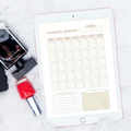 Undated digital minimalist monthly planner PDF template shown on an iPad with a soft neutral beige and warm cream design featuring gold star accents and a botanical illustration, including a full monthly calendar grid with rounded day boxes in Monday through Sunday layout, a top priorities section with five numbered slots, and a notes section — compatible with GoodNotes, Notability, Noteshelf, XODO, Samsung Notes, and Kindle Scribe.